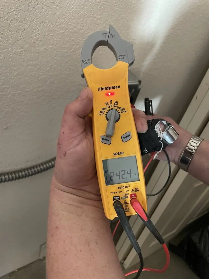 Voltage testing with clamp meter during Aluminum Wiring Replacement in Morton